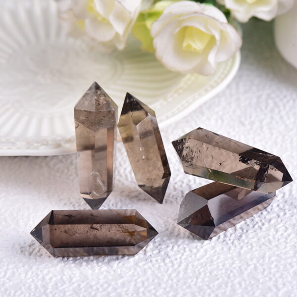 The Natural Brown Quartz Raw Stone is a raw and unpolished piece of brown quartz, displaying its natural texture and rich brown color. Each stone is unique, with variations in size, shape, and color intensity, making it a truly individual piece. Brown quartz is renowned for its grounding and protective properties, helping to neutralize negative energy, promote relaxation, and enhance emotional stability. The Natural Brown Quartz Raw Stone is a raw and unpolished piece of brown quartz, displaying its natural texture and rich brown color. Each stone is unique, with variations in size, shape, and color intensity, making it a truly individual piece. Brown quartz is renowned for its grounding and protective properties, helping to neutralize negative energy, promote relaxation, and enhance emotional stability.