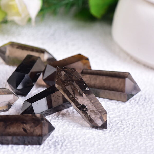 The Natural Brown Quartz Raw Stone is a raw and unpolished piece of brown quartz, displaying its natural texture and rich brown color. Each stone is unique, with variations in size, shape, and color intensity, making it a truly individual piece. Brown quartz is renowned for its grounding and protective properties, helping to neutralize negative energy, promote relaxation, and enhance emotional stability. The Natural Brown Quartz Raw Stone is a raw and unpolished piece of brown quartz, displaying its natural texture and rich brown color. Each stone is unique, with variations in size, shape, and color intensity, making it a truly individual piece. Brown quartz is renowned for its grounding and protective properties, helping to neutralize negative energy, promote relaxation, and enhance emotional stability.